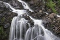 Landscape detail of waterfall over rocks in Summer long exposure Royalty Free Stock Photo