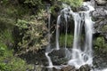 Landscape detail of waterfall over rocks in Summer long exposure Royalty Free Stock Photo