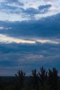 Landscape with dramatic light - beautiful golden sunset with saturated sky and clouds. Royalty Free Stock Photo