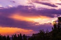 Landscape with dramatic light - beautiful golden sunset with saturated sky and clouds. Royalty Free Stock Photo