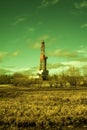 Landscape with a drilling rig at an oil field. Sunny day, early spring. Industrial landscape. Russia, Western Siberia.