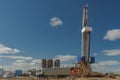 Landscape with a drilling rig in an oil and gas field