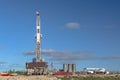 Landscape with a drilling rig in an oil and gas field