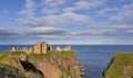 Landscape of Dunnottar Castle ruins withh dark clouds and ocean Royalty Free Stock Photo