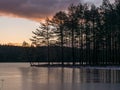 landscape with early sunrise by the lake, heaven sky, black tree silhouettes Royalty Free Stock Photo