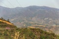 Landscape with electric posts and trees with pink color bus on the left side in summer in Sa Pa, Vietnam