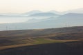 Landscape with electric power line and mountain ranges in the mi Royalty Free Stock Photo