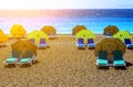 Landscape of Elle beach on Rhodes island. Panorama with sand seacoast with chaise lounges under umbrellas and clear blue water