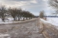 Landscape with empty road leading to Velyka Pavlivka village in Poltavskaya oblast, Ukraine Royalty Free Stock Photo