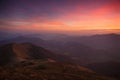 Landscape evening autumn mountains at sunset. A look from the top of the hills. Royalty Free Stock Photo