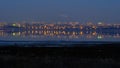 The landscape with the evening lights of the village of Kotovsky, which reflects the Kuyanik in the rhizome. Odessa