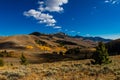 Landscape of Fall in Pass Creek Idaho hills under blue sky, wide shot