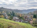 Landscape of a farm surrounded by houses and greenery under a cloudy sky in Ironbridge Royalty Free Stock Photo