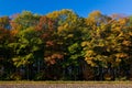 Landscape of a farmland with colorful autumn trees Royalty Free Stock Photo