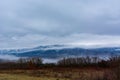 Landscape featuring a dry mountain range with snow and clouds adds to the scenes grandeur