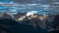 Landscape featuring a majestic mountain range set against a backdrop of clouds Royalty Free Stock Photo