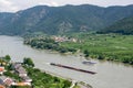 Landscape with ferry ship and heavy freight vessel on a Danube river in Austria near Spitz Royalty Free Stock Photo