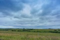 Landscape field, clouds over the field