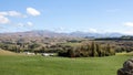 Landscape of fields, mountains and blue sky in autumn on the south island of New Zealand. Royalty Free Stock Photo