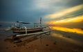Landscape. Fisherman boat jukung. Traditional fishing boat at the beach during sunrise. Sanur beach, Bali, Indonesia
