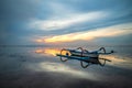 Landscape. Fisherman boat jukung. Traditional fishing boat at the beach during sunrise. Sanur beach, Bali, Indonesia