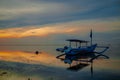 Landscape. Fisherman boat jukung. Traditional fishing boat at the beach during sunrise. Sanur beach, Bali, Indonesia