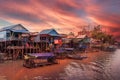 Landscape with floating village on the water of Tonle Sap lake, Cambodia Royalty Free Stock Photo