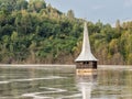 Landscape of a flooded church in toxic polluted lake due to copper mining