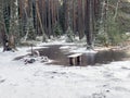 Landscape with flooded lake shore, picnic area covered with ice Royalty Free Stock Photo