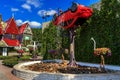 Landscape flower arrangement with a car and a fountain