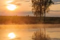 Landscape: fog or steam over lake at sunrise Royalty Free Stock Photo