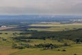 Landscape with forest, fields, factories, and smoke from the chimneys. Royalty Free Stock Photo