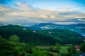 landscape with forest and mountains, in the background mountain peaks in the clouds. Basque Country, Spain Royalty Free Stock Photo