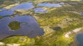 Landscape of the forest-tundra, aerial view, traces of caterpillar equipment on the surface of tundra vegetation, nature