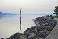 A landscape of the Fork, a stainless steel fork in front of the Alimentarium museum on the shore of Lake Geneva Lac Leman.