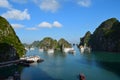 Landscape formed by karst towers-isles on blue sky background. Beautiful view of lagoon in the Halong Bay Descending Dragon Bay