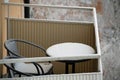 Landscape of a frozen table and chair on a balcony on a winter day in Stockholm