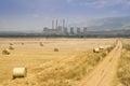 Landscape with fuel-burning power plant and round rickÃâ¹, Greece