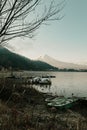 Landscape of Fuji mountain view and Kawaguchiko lake with boats in morning sunrise, winter seasons at yamanachi, Japan.