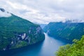Landscape of Geirangerfjord and Seven Sisters Waterfall near small village of Geiranger. View from Eagles Road viewpoint.  Norway Royalty Free Stock Photo