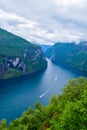Landscape of Geirangerfjord and Seven Sisters Waterfall near small village of Geiranger. View from Eagles Road viewpoint.  Norway Royalty Free Stock Photo