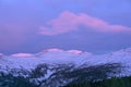 Gently pink sunset over snowy mountains Royalty Free Stock Photo