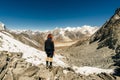 Landscape with girl, high mountains with snowy peaks, path, blue sky in Nepal. Travel. Vintage style. Nature Royalty Free Stock Photo