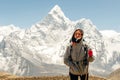 Landscape with girl, high mountains with snowy peaks, path, blue sky in Nepal. Travel. Vintage style. Nature Royalty Free Stock Photo