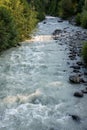 Landscape of glacier melt in Fitzsimmons Creek, mixed forest of deciduous and evergreen, Whistler BC Canada