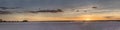 glider landing under colorful sparse clouds at scenic red sunset on desert, Bitterwasser, Namibia Royalty Free Stock Photo