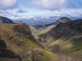 Landscape of Godland and thorsmork with rugged green moss covered rocks and hills, bending river canyon, Iceland