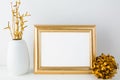 Landscape gold frame mockup with golden decor