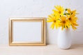 Landscape golden frame mockup with yellow rosinweed flowers Royalty Free Stock Photo