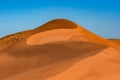 Landscape of golden sand dune with blue sky in Sahara desert Royalty Free Stock Photo